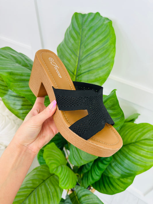 The Cross Over Heeled Mules In Black