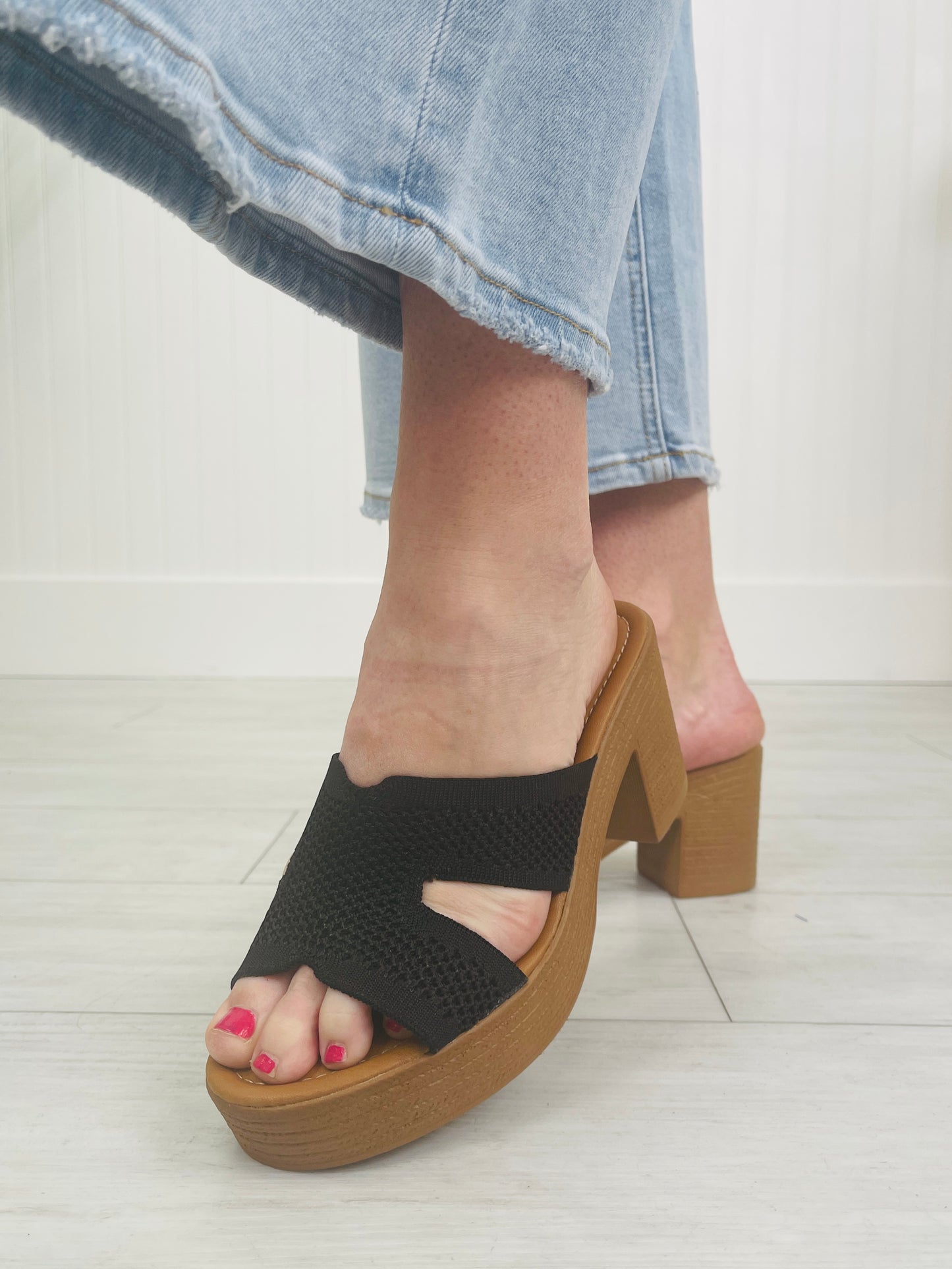 The Cross Over Heeled Mules In Black