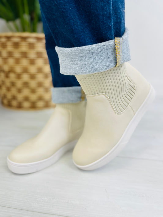 The Right Way To Strut Booties In Ivory